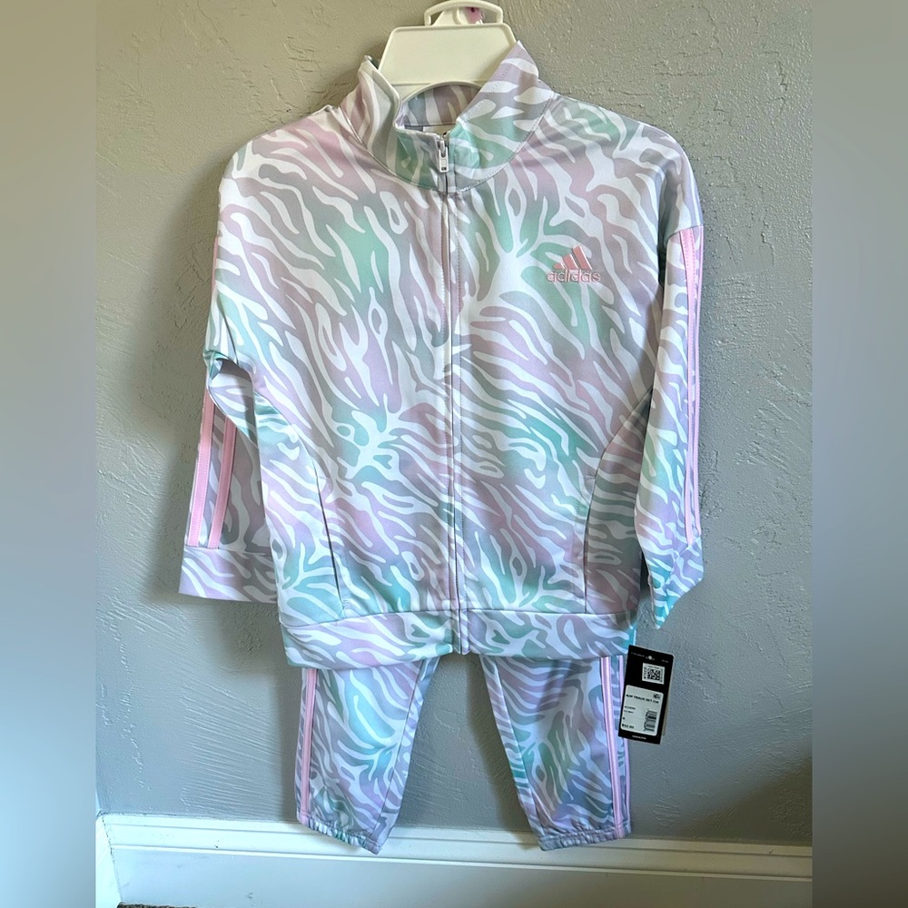 Adidas track suit in color ice mint.